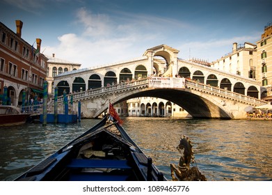 Venice / Italy - August 03 2009:  POV In An Gondola Boat In The Canals Of Venice Passing Rialto Bridge.