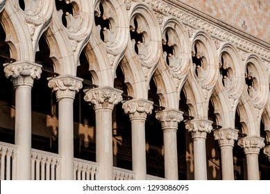 VENICE, ITALY - DECEMBER 24, 2018: Gothic Archtiecture In Venice. A Sample From Doge Palace Medieval Colonnade With Its Characteristic Trefoil Stone Arches And Quatrefoil Windows