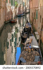 Venice, Italy, Europe - May, 8th, 2021 -  Boat Ride Through The Canals In Venice By Gondola