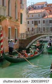 Venice, Italy, Europe - May, 8th, 2021 -  Boat Ride By Typical Gondola