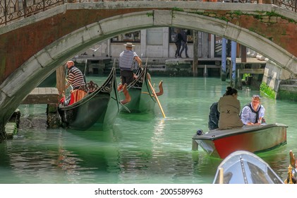 Venice, Italy, Europe - May, 8th, 2021 -  Boat Ride By Typical Gondola