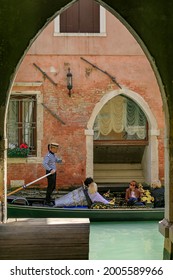 Venice, Italy, Europe - May, 8th, 2021 -  Boat Ride By Typical Gondola