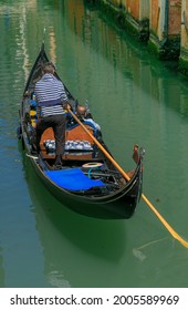 Venice, Italy, Europe - May, 8th, 2021 -  Boat Ride By Typical Gondola