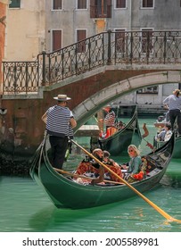 Venice, Italy, Europe - May, 8th, 2021 -  Boat Ride By Typical Gondola