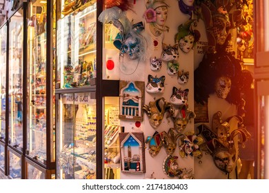 VENICE, ITALY - JUNE 12, 2022: Antique Shop Counter In Venice. Many Venetian Carnival Masks In The Range.