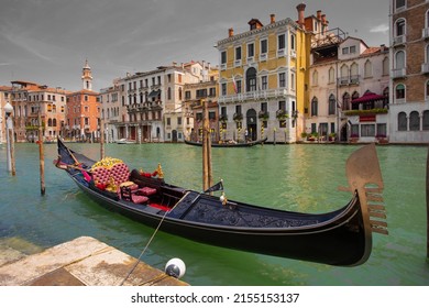 VENICE, ITALY - JUNE 26: Tourists travel on gondolas at canal on June 26, 2014 in Venice, Italy . Gondola trip is the most popular touristic activity in Venice.