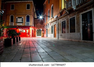 Venice, Italy - March 18, 2015: Night View To A Closed Restaurant With No One On The Street On A Small Square In Venice