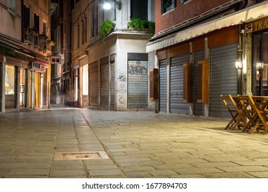 Venice, Italy - March 18, 2015: Night View To A Closed Restaurant With No One On The Street On A Small Square In Venice