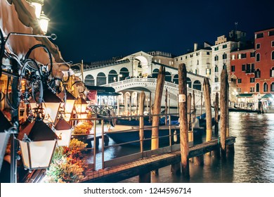 Venice, Italy - Night View Of The Rialto Bridge, In The Foreground Christmas Decorative Lamps