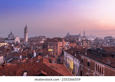 Venice; Italy rooftop skyline towards San Giorgio dei Greci and its leaning bell tower.