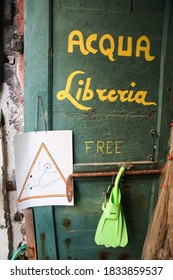 Venice, Italy Sept 5 2008: The Alta Acqua Libreria (High Water Bookstore) Door Sign In Venice, Italy. This Is A Unique Bookstore On A Canal In Venice With Cats Living There And Popular With Tourists.