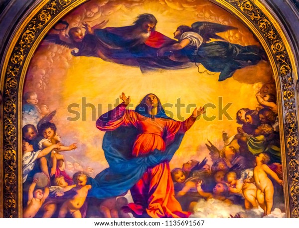 VENICE, ITALY - SEPTEMBER 21, 2017 Titian Assumption Virgin Mary Rise to Heaven  Painting Santa Maria Gloriosa de Frari Church San Polo Venice Italy.  Church completed mid 1400s. Titian Painting  1518
