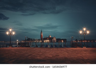Venice at night with street lamp and San Giorgio Maggiore church in Italy.