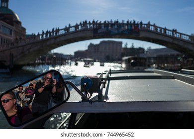 Venice - October 07: Photographer Pierre Aden Makes Photo Of Mirror With Ponte DellAccademia And Tourists In Background