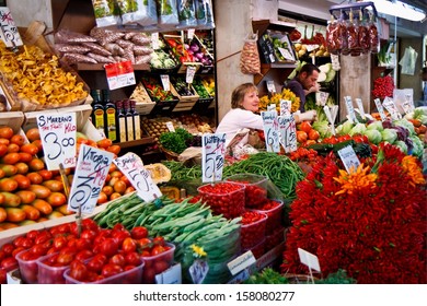 VENICE - SEPTEMBER 4: Woman Sells Vegetables In Food Market On September 4, 2013 In Venice. Traditional Markets Provide Daily Supplies Of Fish, Vegetables Or Fruits Since 1097.