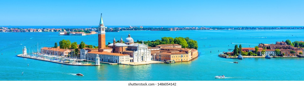 Venice skyline, Italy. San Giorgio Maggiore island in Venetian lagoon. Aerial panoramic view of marine Venice city. Beautiful landscape of Venice in summer. Horizontal banner of Venice in the sea.