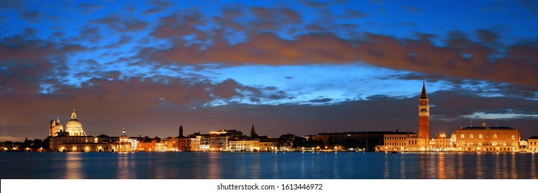 Venice skyline at night with Santa Maria della Salute church and clock tower historical architectures panorama in Italy. - Powered by Shutterstock