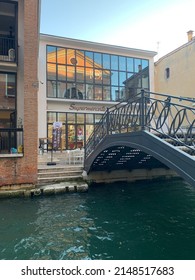 Venice, Veneto, Italy- August 18, 2021: Entrance To The Modern Supermercato (supermarket) Food Groceries Store At The City Centre Of Venice. Metal Bridge Over The Canal.