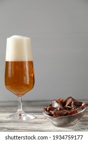 Venison Jerky With A Glass Of Beer On The Table