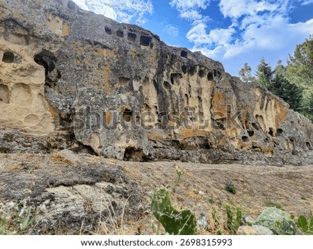 Ventanillas de otuzco pre-inca necropolis featuring carved tombs in rock face