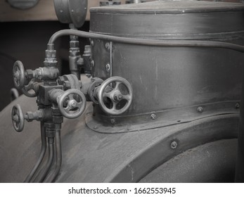 Ventels on the old rustic engine, steam motor, steam engine. Old boat steam motor engine pipes and ventels.