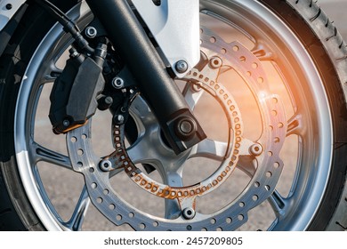 ventilated brake disc of the front wheel of a sports motorcycle. rust. close-up - Powered by Shutterstock