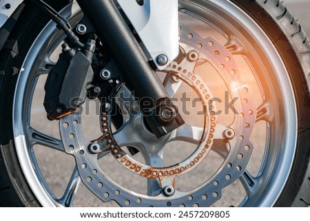 ventilated brake disc of the front wheel of a sports motorcycle. rust. close-up