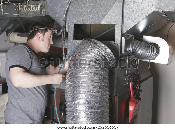 A ventilation\
cleaner man at work with tool