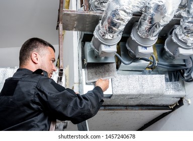 Ventilation Cleaning. Specialist At Work. Repair Ventilation System (HVAC). Industrial Background