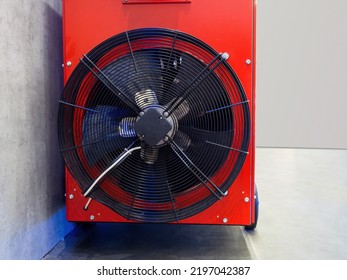 Ventilation Equipment. Air Conditioner Fan Close-up. Conditioning With Split Technology. Red Metal Block With Fan. Ventilation Equipment Near Concrete Wall. Climate Control. Indoor Air Ventilation