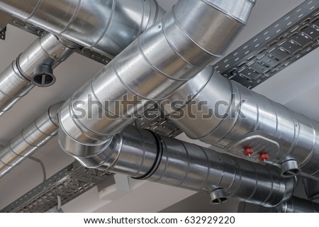 Ventilation pipe system in kitchen interior.