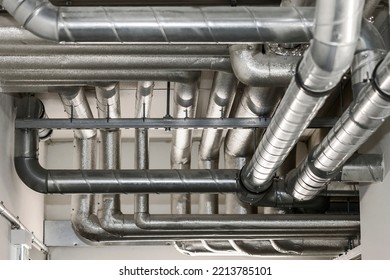 Ventilation Pipes On Ceiling Of Apartment Building. Air Conditioner Duct Pipe System