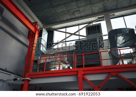 Ventilation system and pipe systems installed on industrial building ceiling