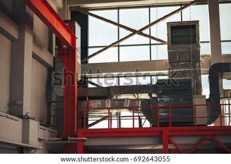 Ventilation system and pipe systems installed on industrial building ceiling