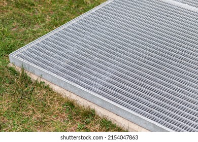Ventilation Vent Exit of Modern Underground Parking. Garvanized Surface Manhole Ventilation on Ground  grass.