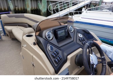 Ventnor City, New Jersey - September, 2021: Close up of the dashboard control panel and steering wheel of a boat