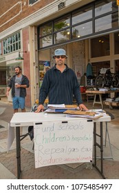 Ventura, CA: March 31, 2018: A Signature Gatherer For Upcoming Ballot Initiatives In The State Of California.  In California, Voters Vote On Proposed Laws Via Ballot Propositions.