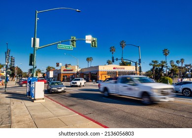 Ventura, United States - February 21 2020: A Busy Intersection In Rush Hour With Traffic Lights Palm Trees And A California Street Sign