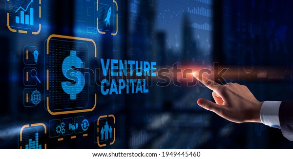 Venture capital. Investor capital.\
Businessman pressing virtual screen\
inscription