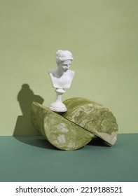 Venus Bust On Podium With Plaster Geometric Shapes On A Two Tone Background. Creative Still Life