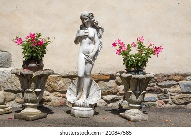 Venus Statue In Front Of A House