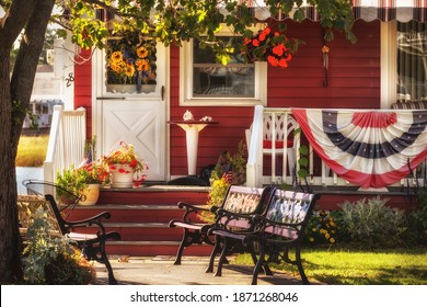 The veranda of a traditional American house is decorated with US decorations.
 - Powered by Shutterstock