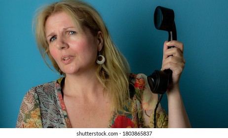 Verbal Abuse On The Phone With Woman Holding Telephone Handset 