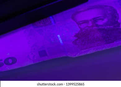 Verifying The Authenticity Of The Fifty Hryvnia Banknote In Ultraviolet Light. Ukrainian Money. Mykhailo Hrushevsky. Equipment For In-depth Inspection Of Money. Fake Money Or Financial Crisis Concept