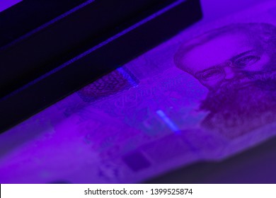 Verifying The Authenticity Of The Fifty Hryvnia Banknote In Ultraviolet Light. Ukrainian Money. Mykhailo Hrushevsky. Equipment For In-depth Inspection Of Money. Fake Money Or Financial Crisis Concept