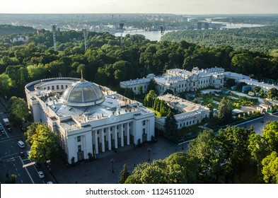 Verkhovna Rada building (parliament house) on hrushevsky street and Mariyinsky palace in Mariinsky park , Kiev, Ukraine - Shutterstock ID 1124511020