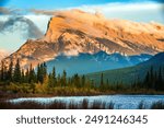 The Vermilion Lakes are a series of lakes located immediately west of Banff, Alberta, in the Canadian Rocky Mountains with Mount Rundle at background at sunset.