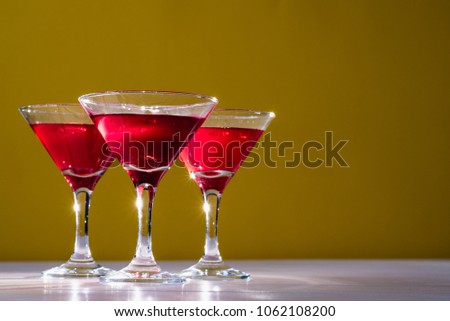 vermouth in conical glasses, red wine in glasses for vermouth, glamorous colors