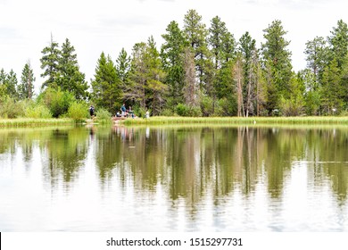 Vernal, USA - July 24, 2019: Small Lake Pond With People Fishing In Flaming Gorge Utah National Park During Summer