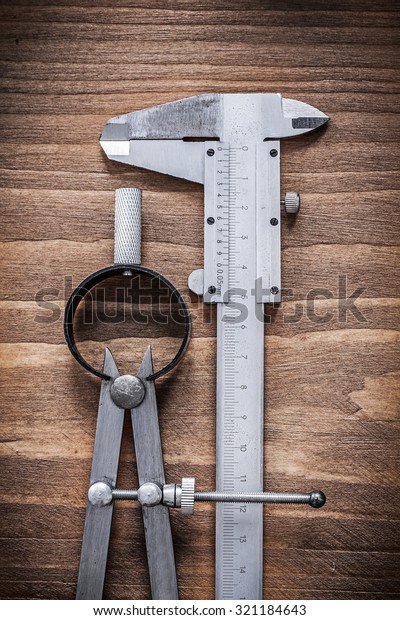Vernier scale divider on wooden board\
construction concept.